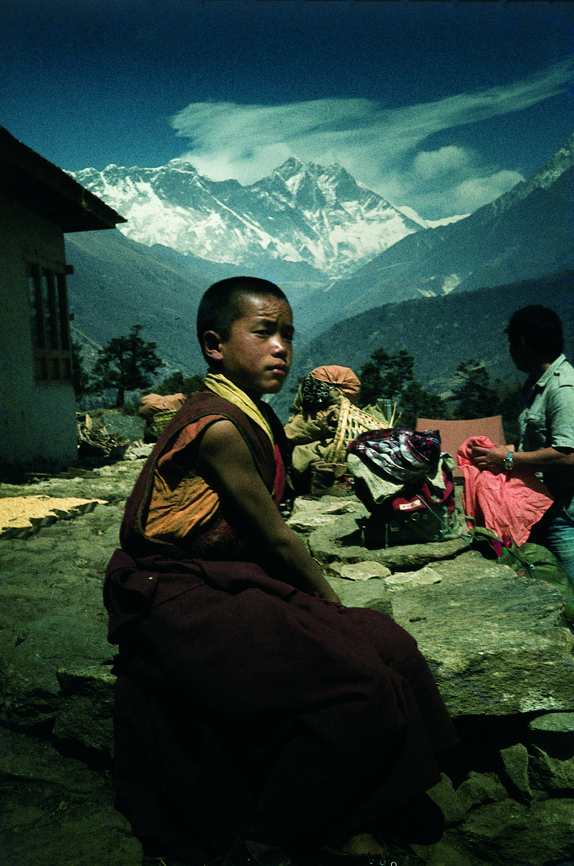 Buddhist boy in Thangboche monastery with Mount Everest in the background
